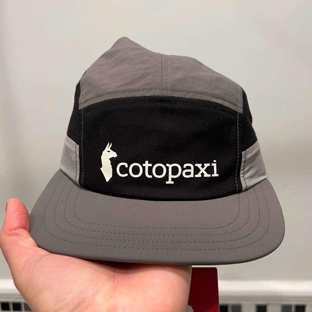 Black and grey Cotopaxi 5 Panel Hat